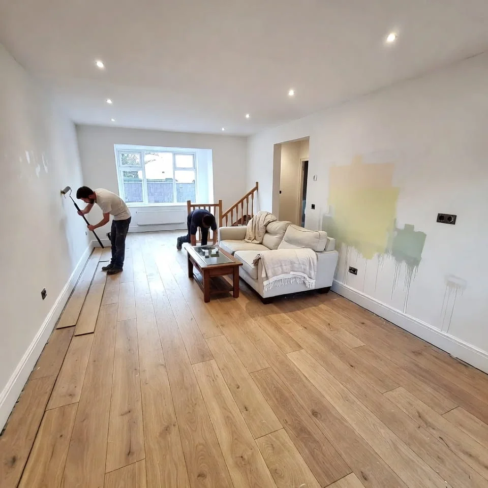 Workers installing wooden flooring during a home improvement project in Berkshire